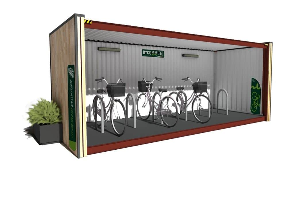 Abri vélo container avec des vélos stationnés à l’intérieur, conçu par Bycommute, avec des parois en métal et bois.